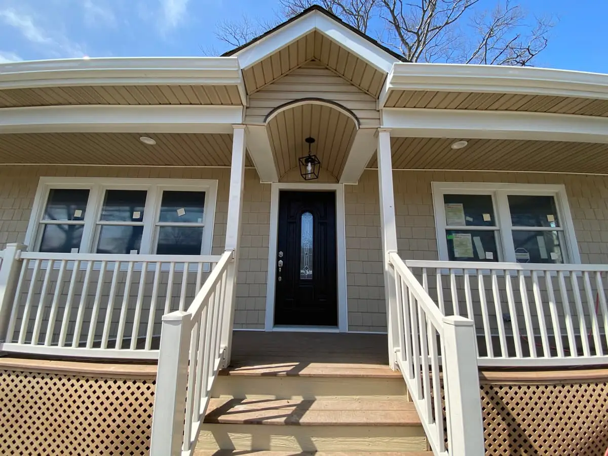 Selling a rental property in Massapequa: renovated front porch with white railings